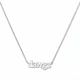 A Dawgs Gameday Necklace by Skōsh Jewelry, featuring the word 'dawgs' in lowercase letters set horizontally on a fine sterling silver chain, displayed against a white background.