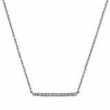 A Luminary White Cubic Zirconia Bar Necklace by Skōsh Jewelry, featuring a long slim bar lined with small clear stones on a fine sterling silver chain, displayed against a white background.