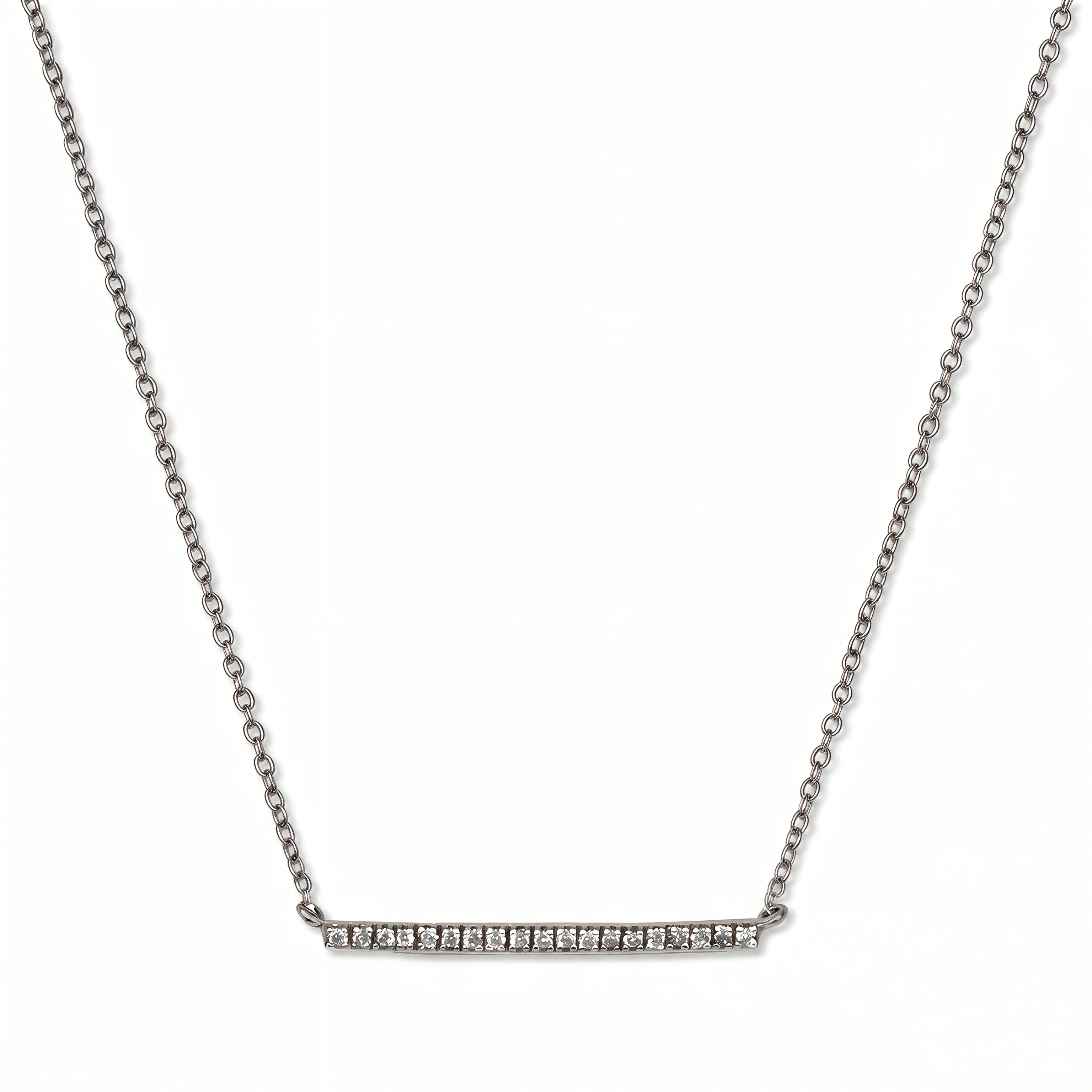 A Luminary White Cubic Zirconia Bar Necklace by Skōsh Jewelry, featuring a long slim bar lined with small clear stones on a fine sterling silver chain, displayed against a white background.