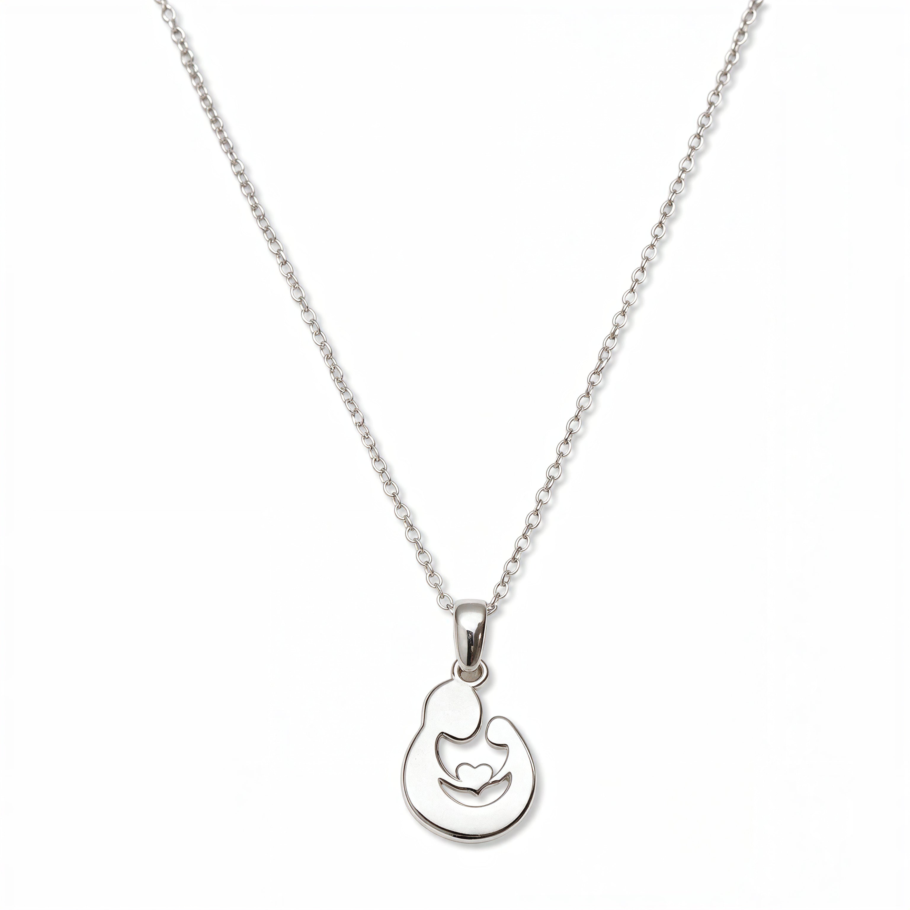 A Mother and Child Pendant Necklace by Skōsh Jewelry, featuring a rounded pendant with a cutout silhouette of a mother holding her child on a fine sterling silver chain, displayed against a white background.