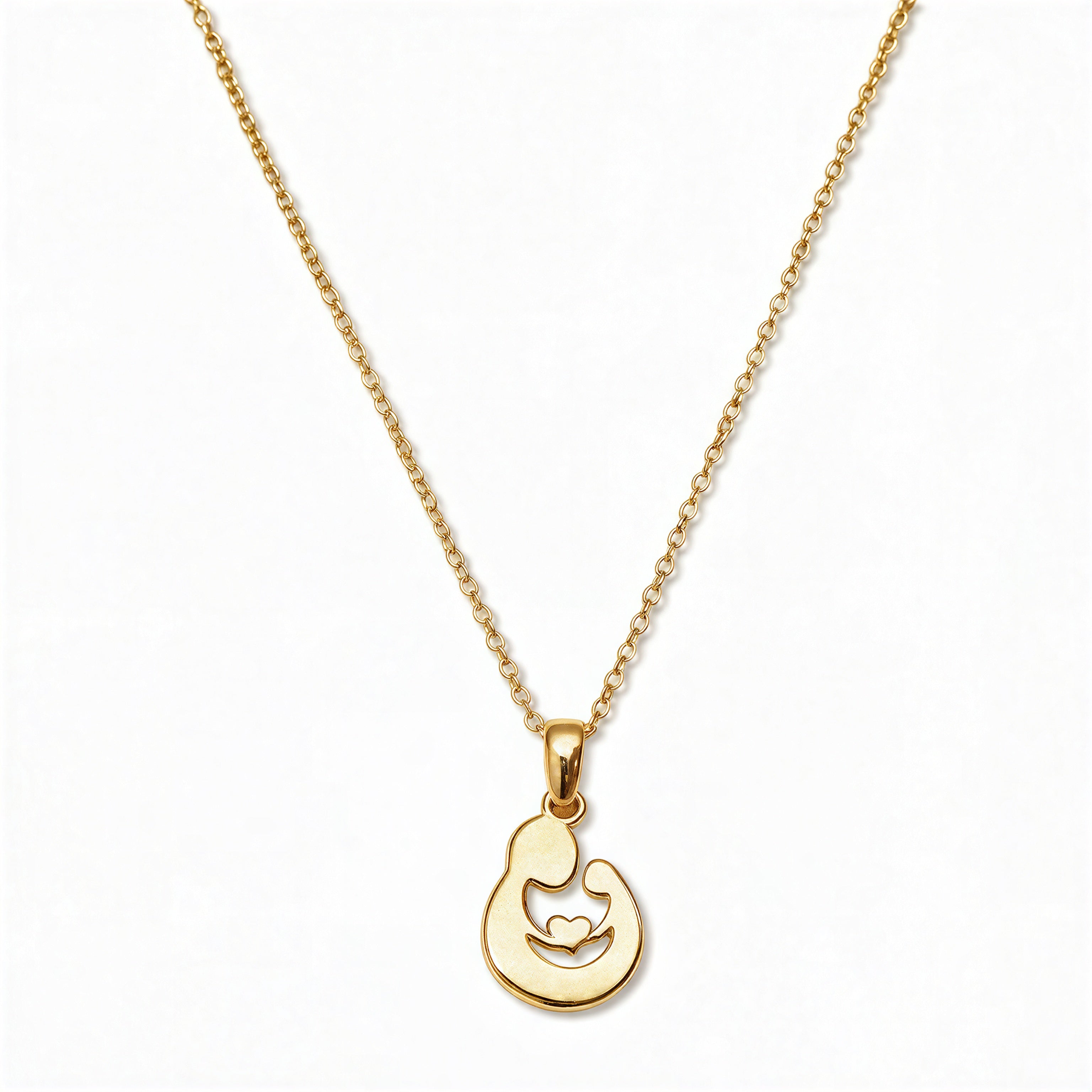 A Mother and Child Pendant Necklace by Skōsh Jewelry, featuring a rounded pendant with a cutout silhouette of a mother holding her child on a fine gold chain, displayed against a white background.