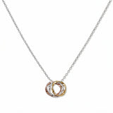 A Tri-Tone Three Circles Necklace by Skōsh Jewelry, featuring three interlocking hammered circles in silver, gold and rose gold tones on a fine chain, displayed against a white background.