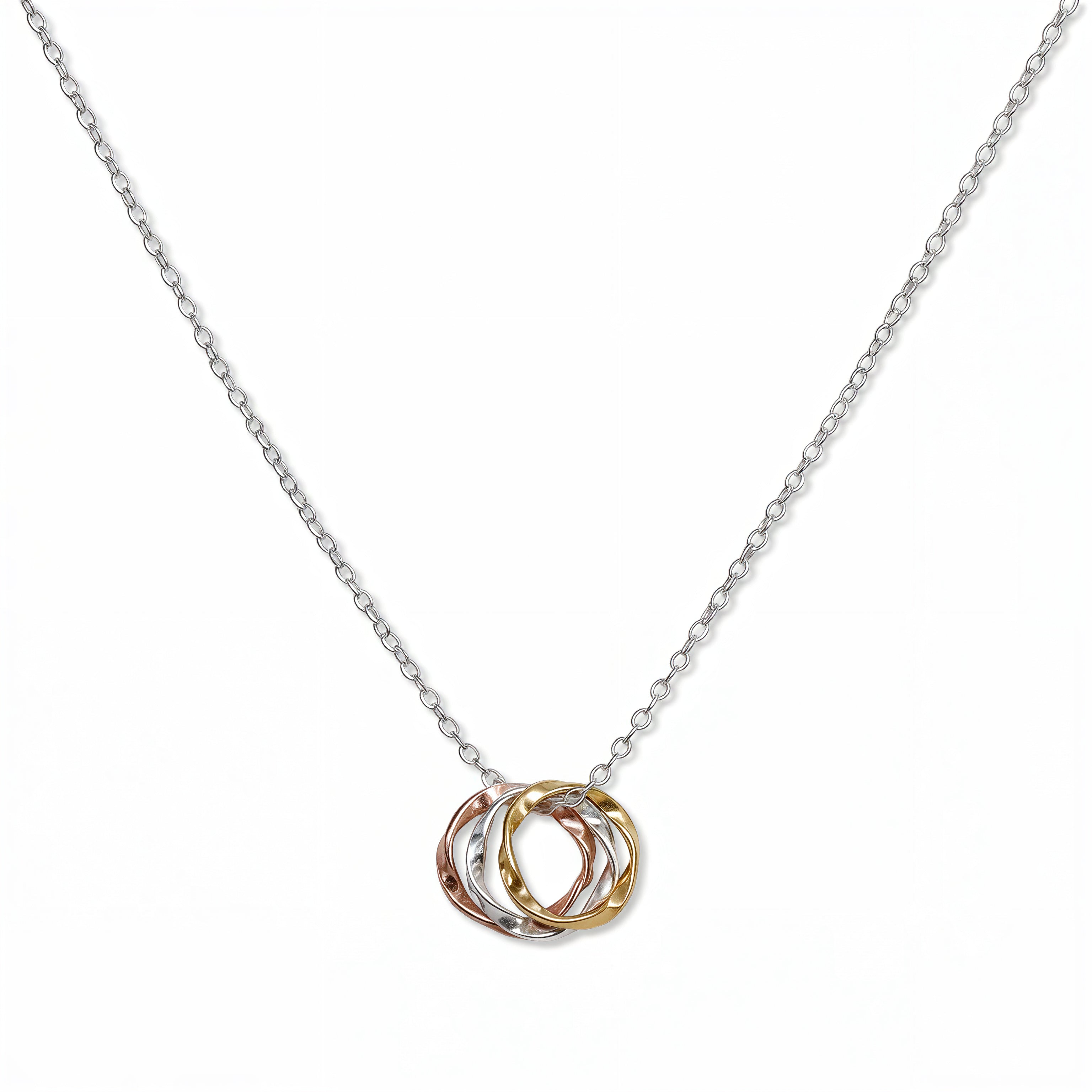 A Tri-Tone Three Circles Necklace by Skōsh Jewelry, featuring three interlocking hammered circles in silver, gold and rose gold tones on a fine chain, displayed against a white background.