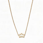 A Rise Crown Necklace by Skōsh Jewelry, featuring a small open crown outline set horizontally on a fine gold chain, displayed against a white background.