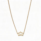 A Rise Crown Necklace by Skōsh Jewelry, featuring a small open crown outline set horizontally on a fine gold chain, displayed against a white background.