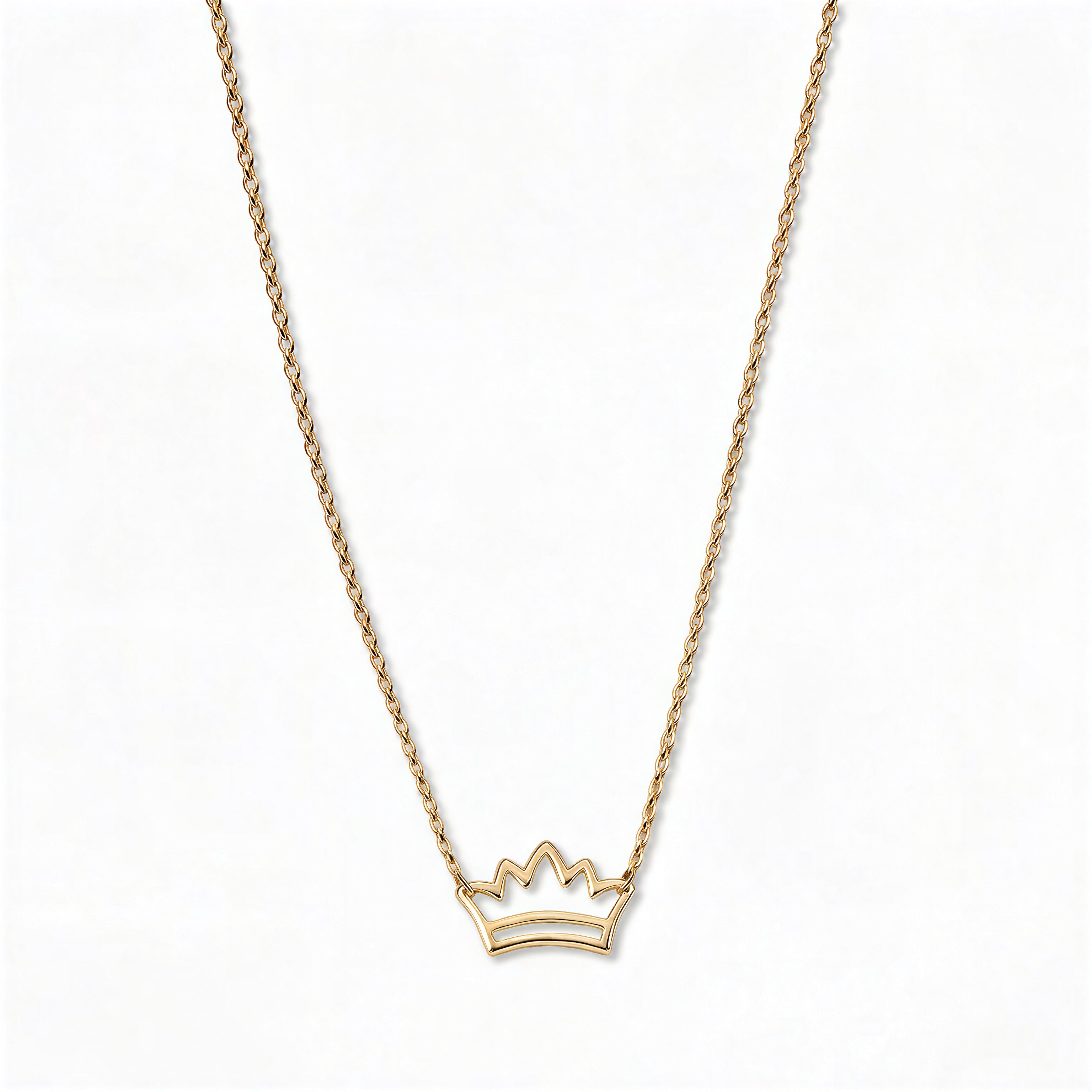 A Rise Crown Necklace by Skōsh Jewelry, featuring a small open crown outline set horizontally on a fine gold chain, displayed against a white background.