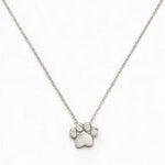 A Bulldogs Paw Print Gameday Necklace by Skōsh Jewelry, featuring a polished paw print pendant on a fine sterling silver chain, displayed against a white background.