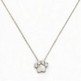 A Bulldogs Paw Print Gameday Necklace by Skōsh Jewelry, featuring a polished paw print pendant on a fine sterling silver chain, displayed against a white background.