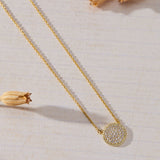 Luna Glow Pavé Disc White Cubic Zirconia Necklace in 14K gold over sterling silver by Skōsh Jewelry