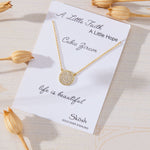Luna Glow Pavé Disc White Cubic Zirconia Necklace in 14K gold over sterling silver by Skōsh Jewelry
