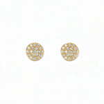 A pair of Luna Glow Pavé Disc White Cubic Zirconia Earrings by Skōsh Jewelry, featuring round discs covered in small clear pavé stones set in gold, displayed against a white background.