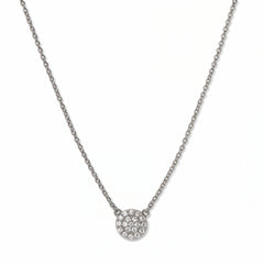 A Luna Glow Pavé Disc White Cubic Zirconia Necklace by Skōsh Jewelry, featuring a round disc covered in small clear pavé stones on a fine sterling silver chain, displayed against a white background.