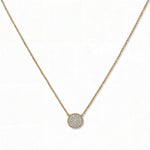 A Purelight Pavé Disc White Cubic Zirconia with Braided Halo Necklace by Skōsh Jewelry, featuring a round pavé disc of clear stones framed by a braided gold halo on a fine chain, displayed against a white background.