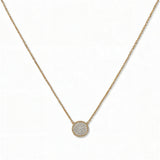 A Purelight Pavé Disc White Cubic Zirconia with Braided Halo Necklace by Skōsh Jewelry, featuring a round pavé disc of clear stones framed by a braided gold halo on a fine chain, displayed against a white background.