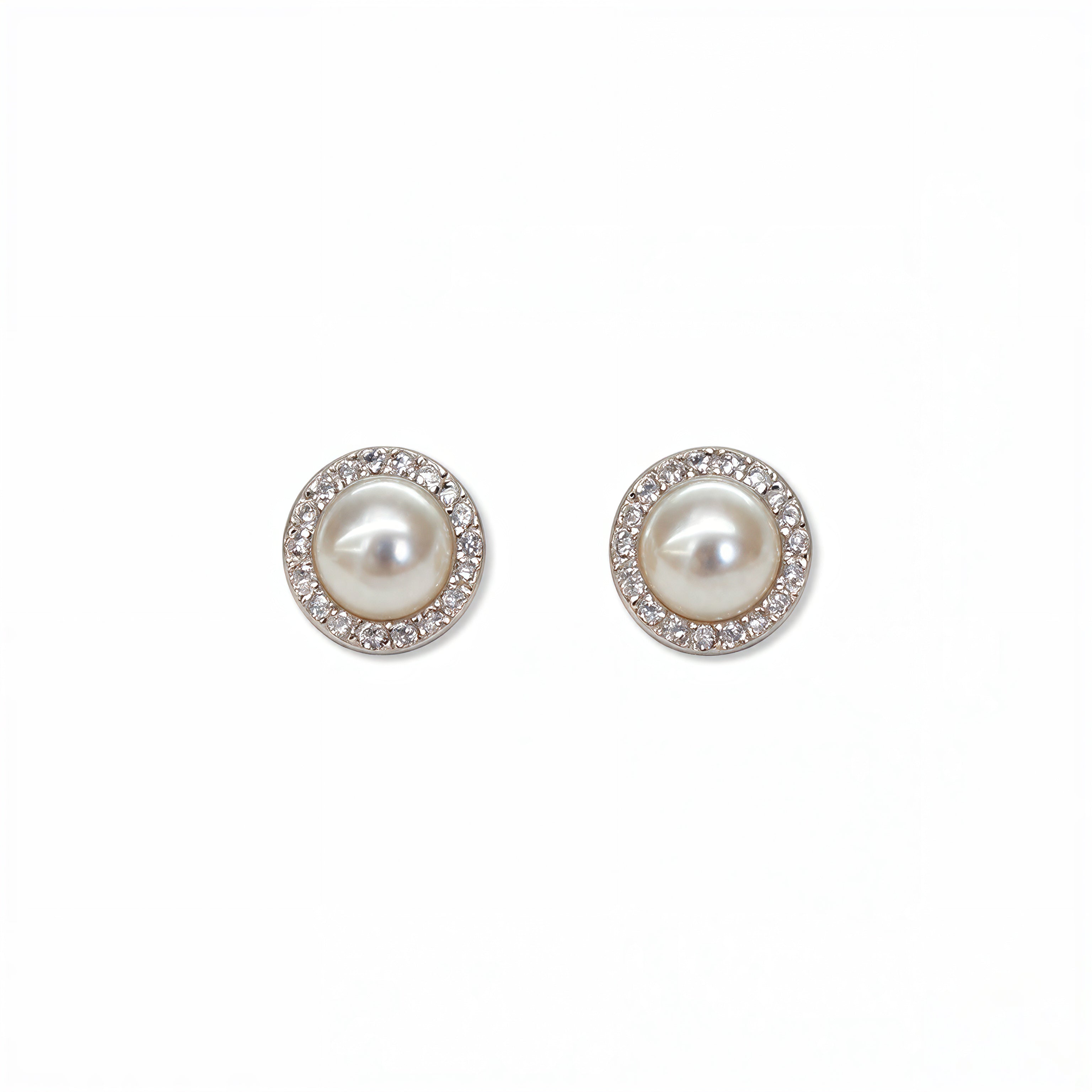 A pair of Freshwater Pearl with White Cubic Zirconia Halo Earrings by Skōsh Jewelry, featuring round white freshwater pearls framed by halos of small clear stones in sterling silver, displayed against a white background.