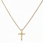 A Redemption Hammered Cross with White Cubic Zirconia Necklace by Skōsh Jewelry, featuring a hammered cross accented with three small clear stones on a fine gold chain, displayed against a white background.