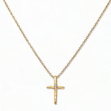 A Redemption Hammered Cross with White Cubic Zirconia Necklace by Skōsh Jewelry, featuring a hammered cross accented with three small clear stones on a fine gold chain, displayed against a white background.