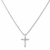 A Redemption Hammered Cross with White Cubic Zirconia Necklace by Skōsh Jewelry, featuring a hammered cross accented with three small clear stones on a fine sterling silver chain, displayed against a white background.