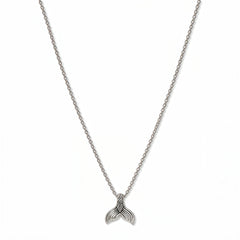 A Mermaid Tail Pendant Necklace by Skōsh Jewelry, featuring a small textured mermaid tail pendant on a fine sterling silver chain, displayed against a white background.