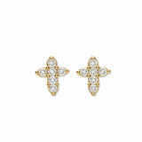 A pair of Shine Mini Cross with White Cubic Zirconia Earrings by Skōsh Jewelry, featuring small crosses formed from clear stones in gold, displayed against a white background.