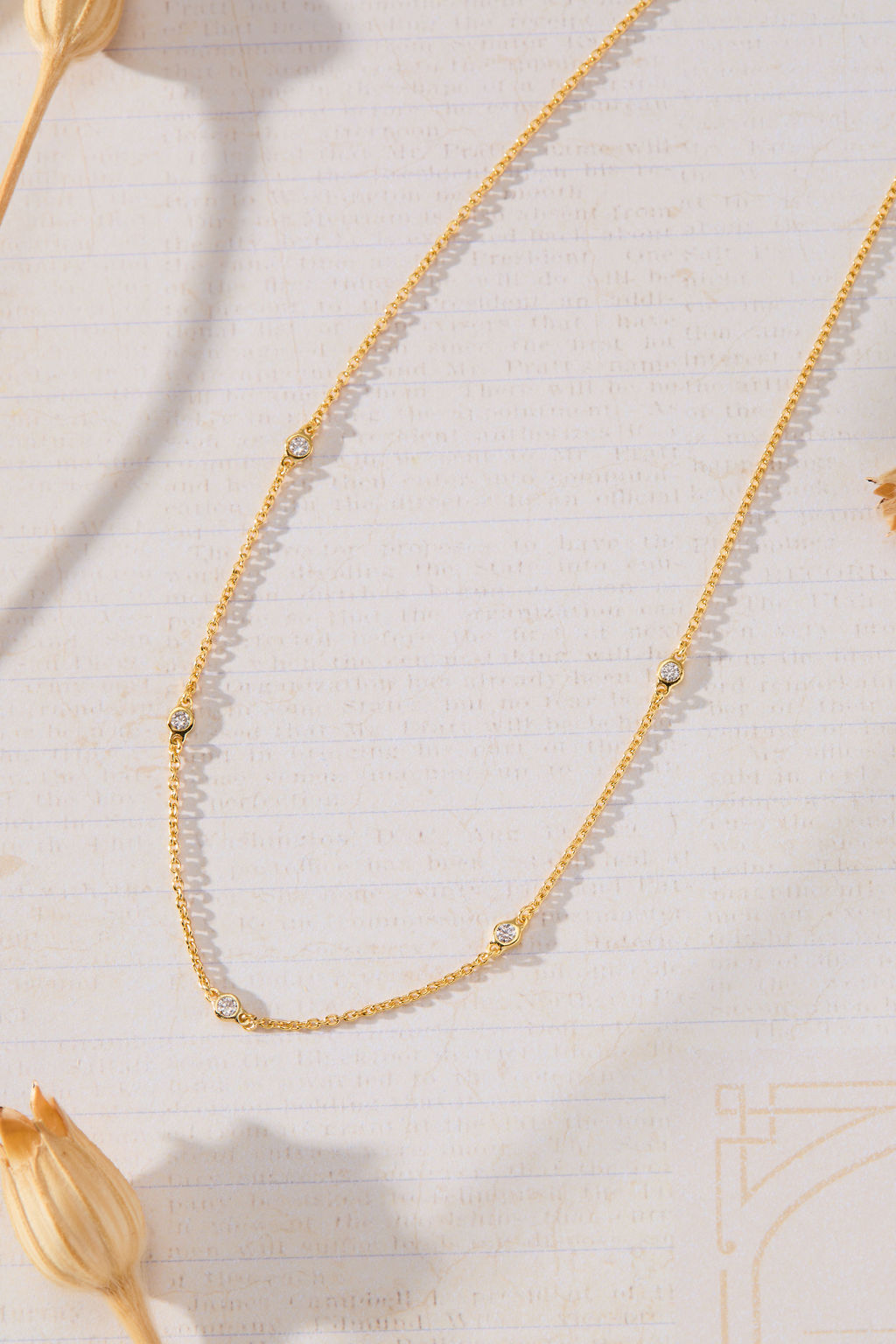 Sanctuary Bezel Set White Cubic Zirconia Station Necklace in 14K gold over sterling silver by Skōsh Jewelry