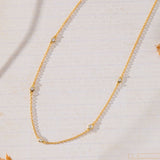 Sanctuary Bezel Set White Cubic Zirconia Station Necklace in 14K gold over sterling silver by Skōsh Jewelry