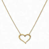 A Tender Heart Necklace by Skōsh Jewelry, featuring a large open heart outline set on a fine gold chain, displayed against a white background.