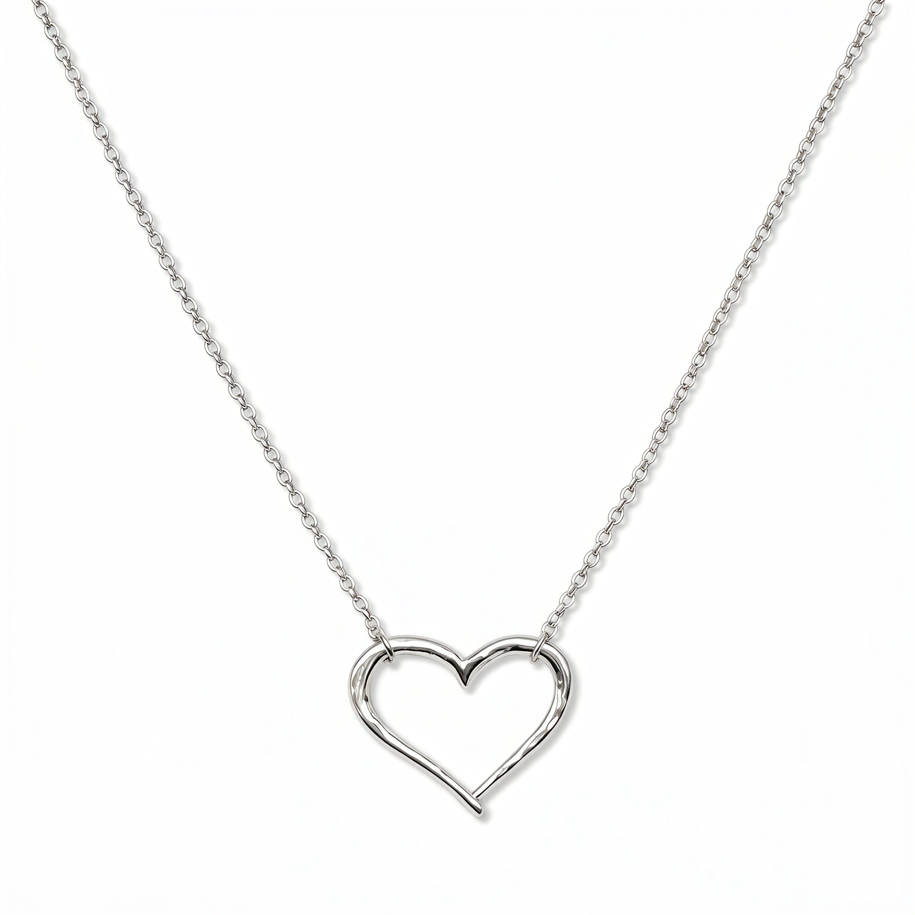 A Tender Heart Necklace by Skōsh Jewelry, featuring a large open heart outline set on a fine sterling silver chain, displayed against a white background.