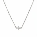 A Steadfast Grace Sideways Cross with White Cubic Zirconia Necklace by Skōsh Jewelry, featuring a small sideways cross accented with clear stones on a fine sterling silver chain, displayed against a white background.