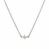 A Steadfast Grace Sideways Cross with White Cubic Zirconia Necklace by Skōsh Jewelry, featuring a small sideways cross accented with clear stones on a fine sterling silver chain, displayed against a white background.
