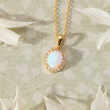 Ethereal Opal with White Cubic Zirconia Halo Pendant Necklace in 14K gold over sterling silver by Skōsh Jewelry