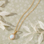 Ethereal Opal with White Cubic Zirconia Halo Pendant Necklace in 14K gold over sterling silver by Skōsh Jewelry