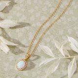Ethereal Opal with White Cubic Zirconia Halo Pendant Necklace in 14K gold over sterling silver by Skōsh Jewelry