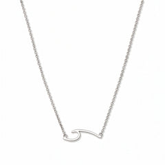 An Unbreakable Wave Necklace by Skōsh Jewelry, featuring a curling ocean wave shape set sideways on a fine sterling silver chain, displayed against a white background.