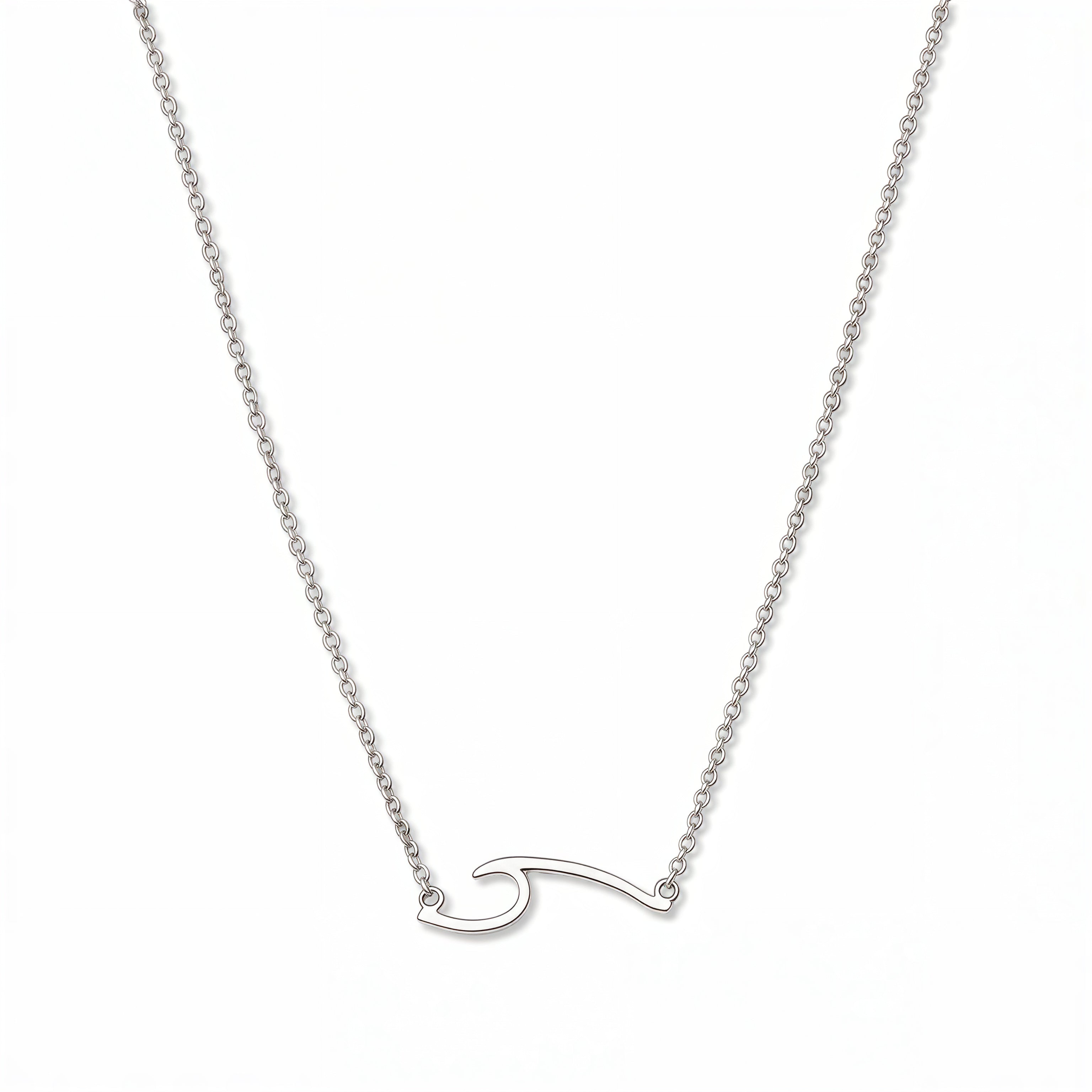 An Unbreakable Wave Necklace by Skōsh Jewelry, featuring a curling ocean wave shape set sideways on a fine sterling silver chain, displayed against a white background.