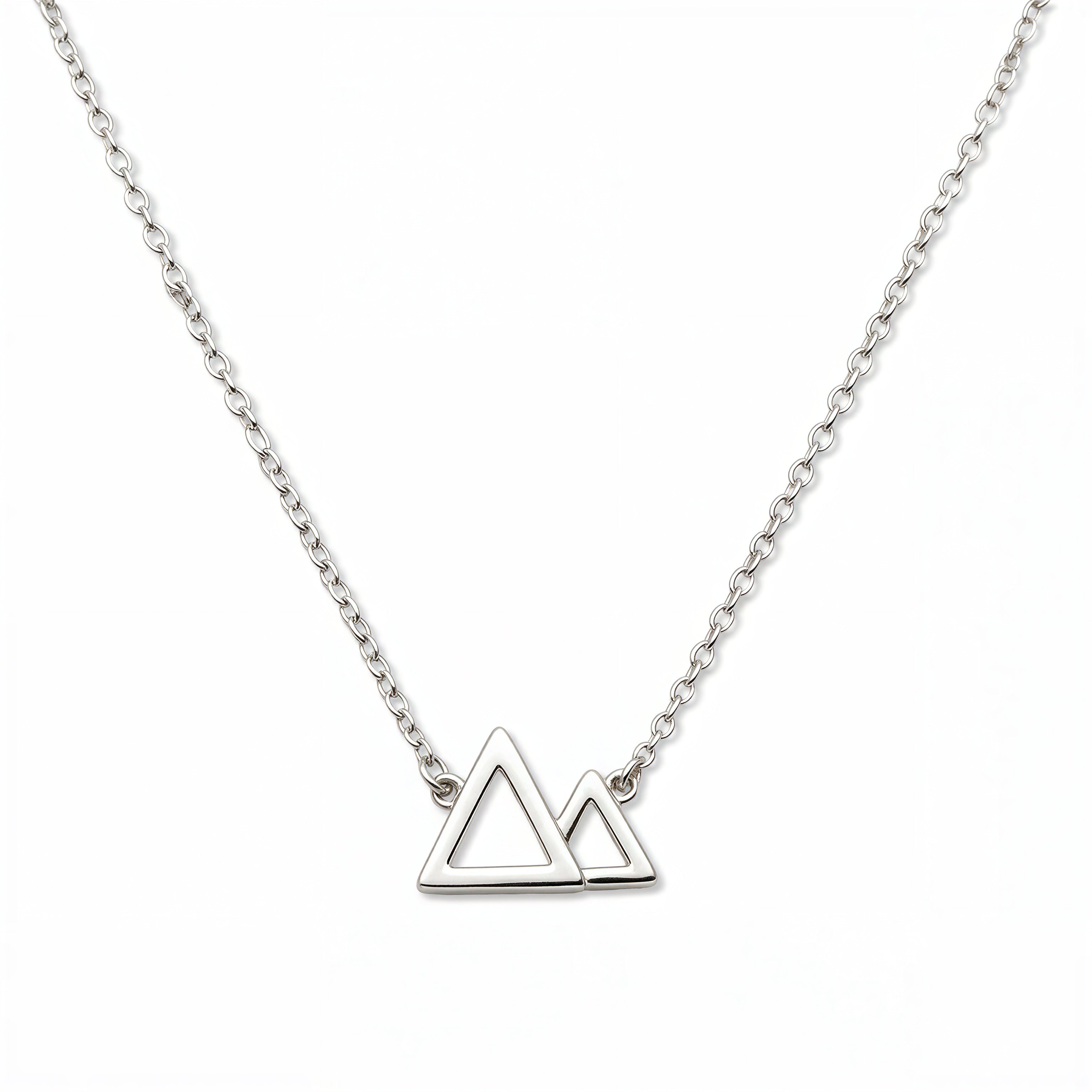 A Mountains and Valleys Necklace by Skōsh Jewelry, featuring an open outline of two mountain peaks set on a fine sterling silver chain, displayed against a white background.