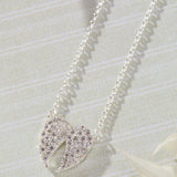 Celestial Pavé White Cubic Zirconia Wings Necklace in sterling silver by Skōsh Jewelry
