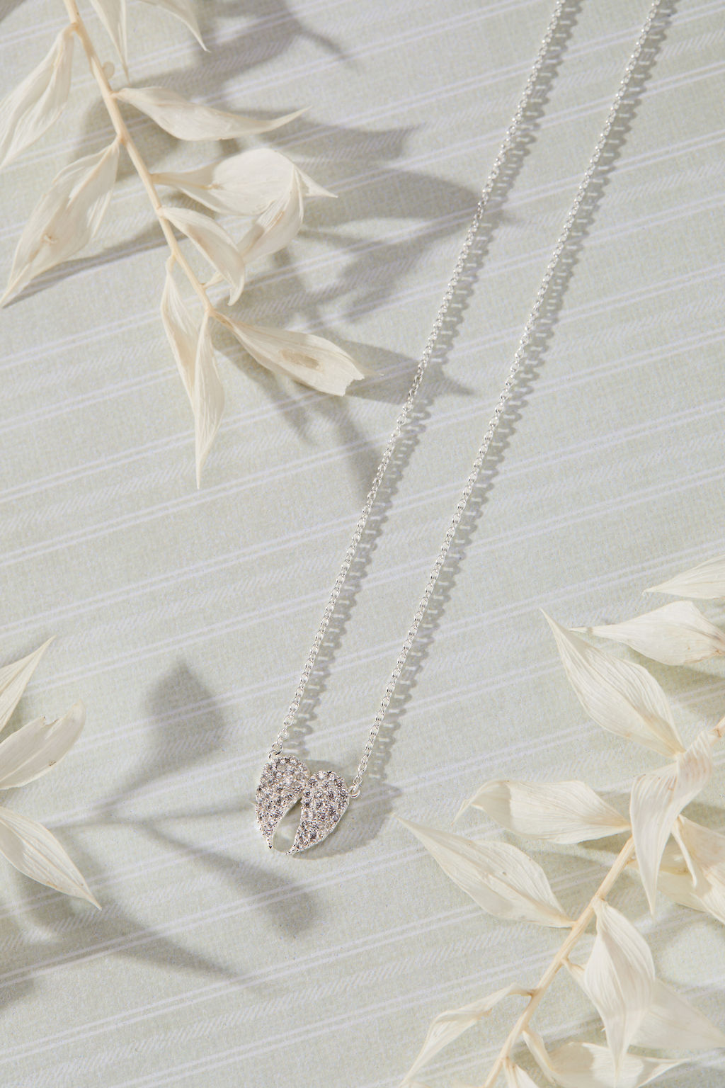 Celestial Pavé White Cubic Zirconia Wings Necklace in sterling silver by Skōsh Jewelry