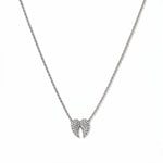 A Celestial Pavé White Cubic Zirconia Wings Necklace by Skōsh Jewelry, featuring a pair of angel wings covered in small clear pavé stones on a fine sterling silver chain, displayed against a white background.