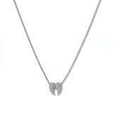 A Celestial Pavé White Cubic Zirconia Wings Necklace by Skōsh Jewelry, featuring a pair of angel wings covered in small clear pavé stones on a fine sterling silver chain, displayed against a white background.