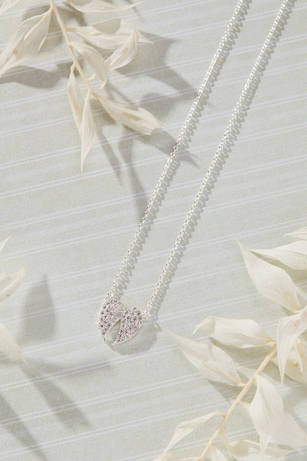 Celestial Pavé White Cubic Zirconia Wings Necklace in sterling silver by Skōsh Jewelry