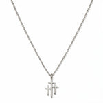 A Trinity Triple Cross Pendant Necklace by Skōsh Jewelry, featuring three slim crosses joined side by side, the center one tallest, on a fine sterling silver chain, displayed against a white background.