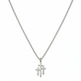 A Trinity Triple Cross Pendant Necklace by Skōsh Jewelry, featuring three slim crosses joined side by side, the center one tallest, on a fine sterling silver chain, displayed against a white background.