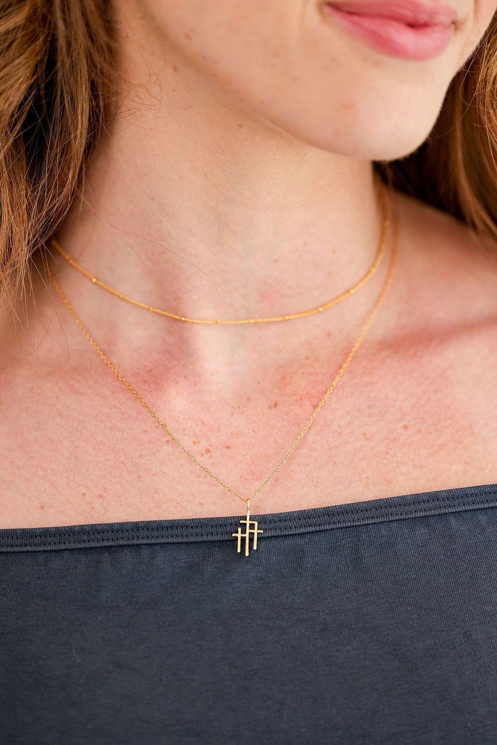 Trinity Triple Cross Pendant Necklace in 14K gold over sterling silver by Skōsh Jewelry