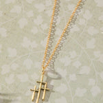 Trinity Triple Cross Pendant Necklace in 14K gold over sterling silver by Skōsh Jewelry