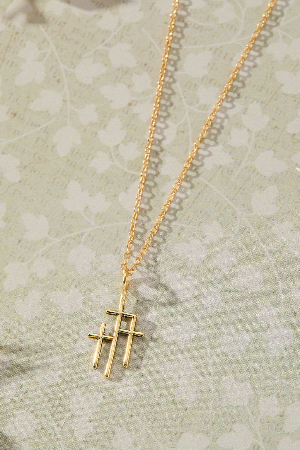 Trinity Triple Cross Pendant Necklace in 14K gold over sterling silver by Skōsh Jewelry