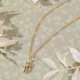 Trinity Triple Cross Pendant Necklace in 14K gold over sterling silver by Skōsh Jewelry