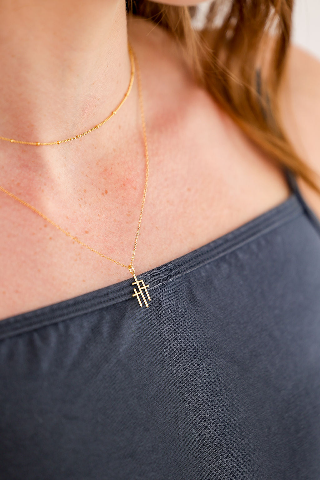 Trinity Triple Cross Pendant Necklace in 14K gold over sterling silver by Skōsh Jewelry