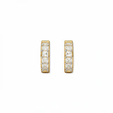 A pair of White Cubic Zirconia Huggie Hoop Earrings by Skōsh Jewelry, featuring small gold huggie hoops set with sparkling clear stones, displayed against a white background.