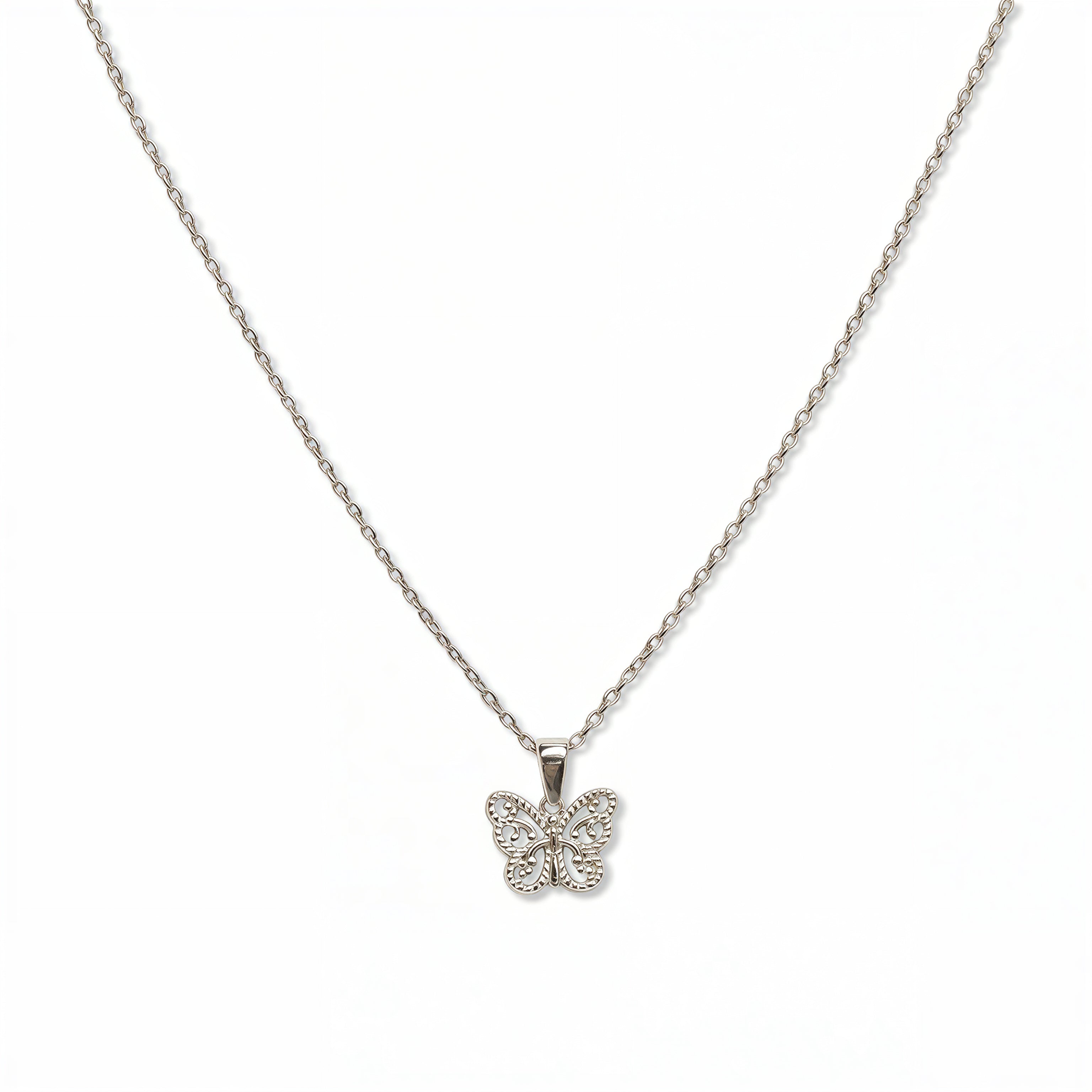 A Filigree Butterfly Pendant Necklace by Skōsh Jewelry, featuring a small butterfly with lacy filigree wings on a fine sterling silver chain, displayed against a white background.